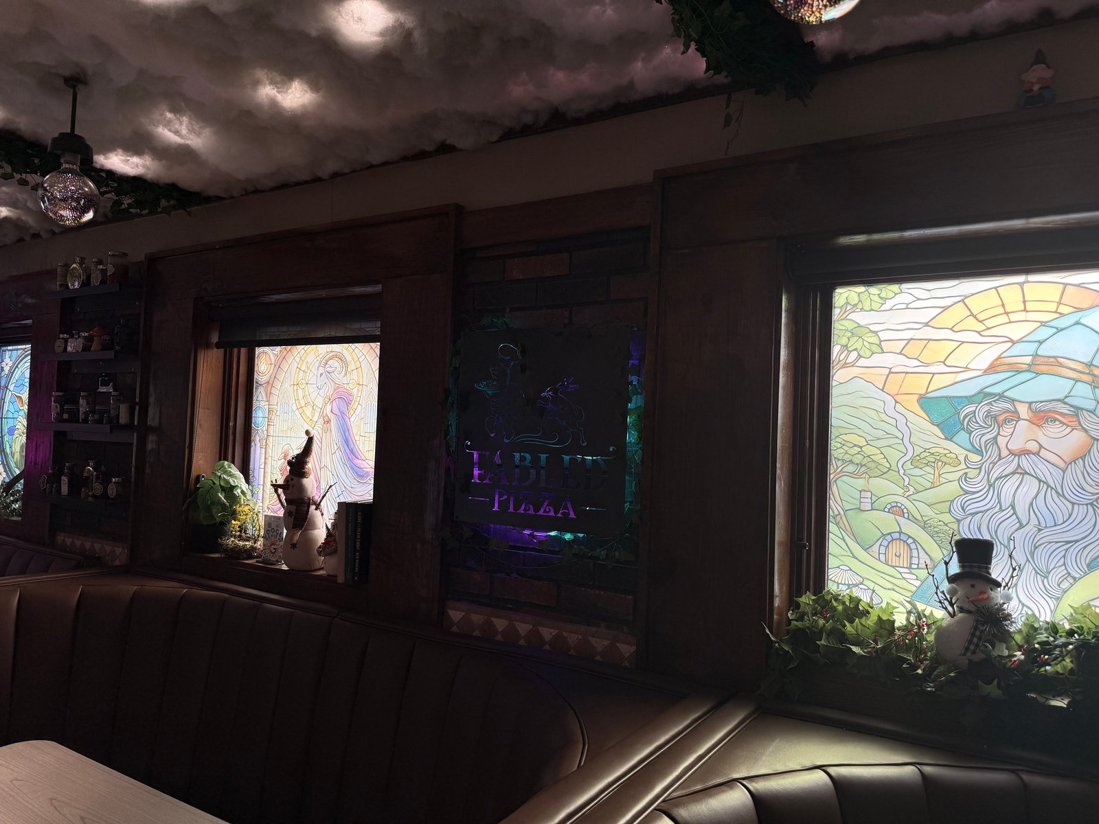 Wizard and fairy stained glass with Fabled Pizza sign